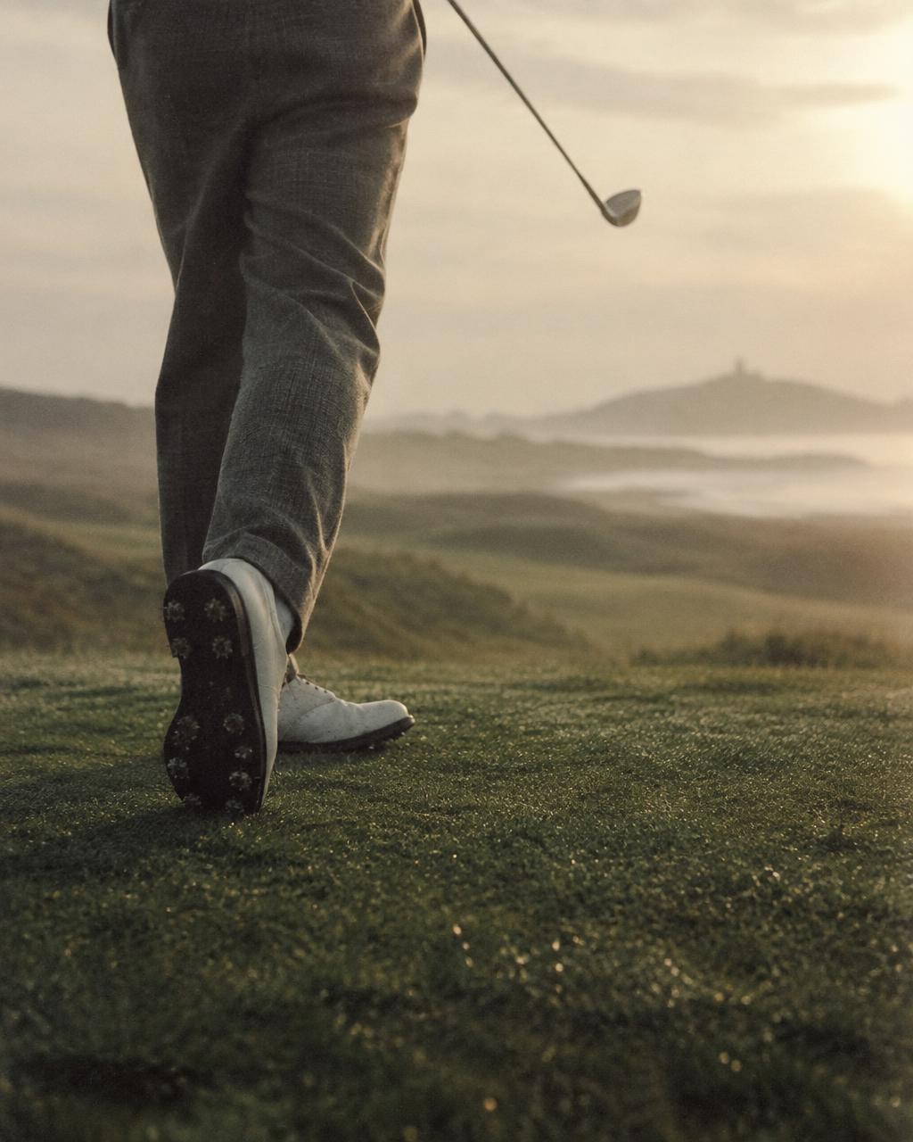 Golfer's trail foot rotating onto the toe at the finish